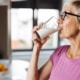 elderly woman drinking milk