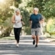 Senior couple walking together in a park.
