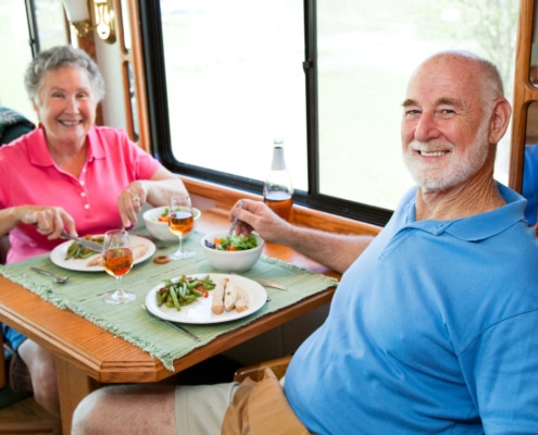 Seniors enjoying a meal after hospital discharge